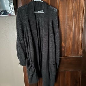 more like a large. very cozy and long with pockets!
